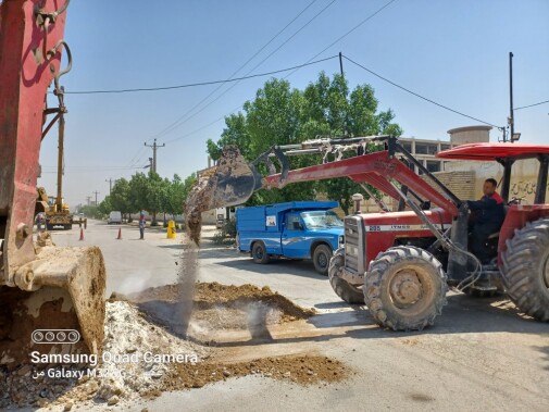 Filling around the manhole with a mixture of soil and lime