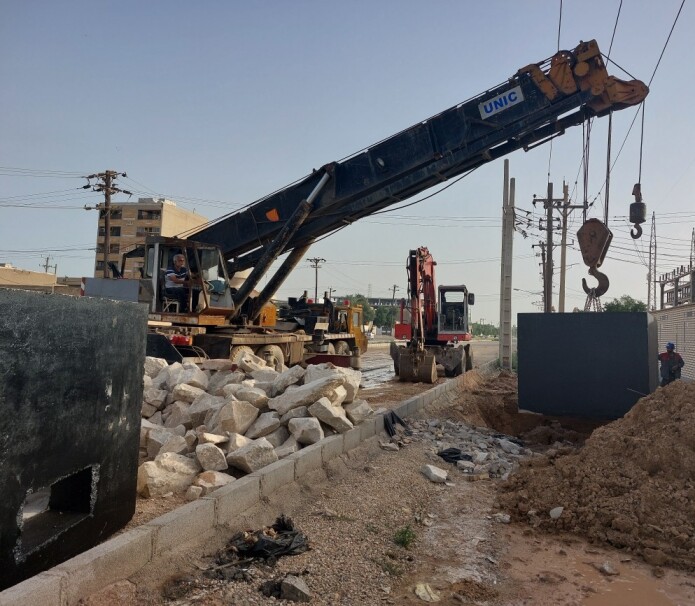 Carrying and placing manhole