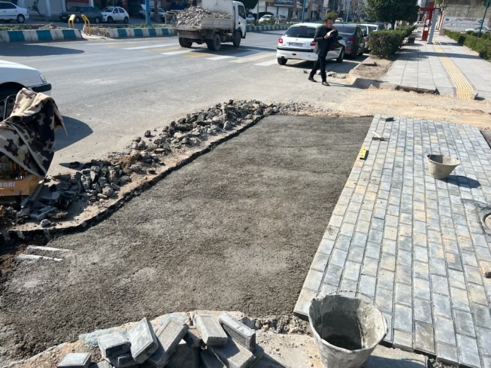 Paving of the sidewalk of Enghelab St